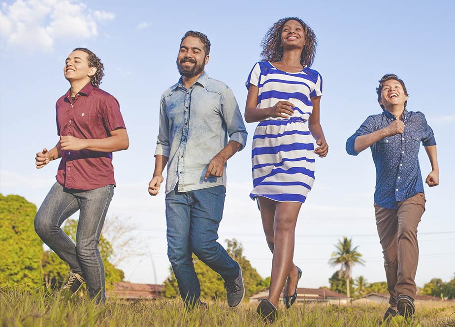 Group of excited friends run to Aristotle High Speed Internet
